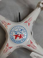 Drone top view showing FH logo and rotor hubs