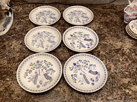 Six Figgjo Lotte bread plates laid out to show pattern and overall condition