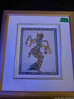 Full view of framed artwork showing frame, matting and overall condition