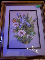 Framed floral relief artwork showing raised bouquet, mat, frame and signature