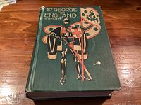 Front cover of St. George for England hardcover showing illustration and wear