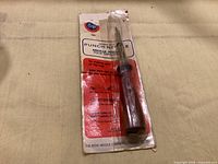 Full view of Boye punch needle on original card