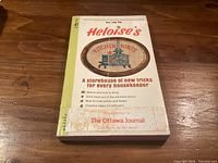 Front cover of paperback book showing title, price and tagline