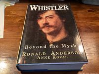 Front cover of hardcover book showing title, authors Ronald Anderson & Anne Koval, portrait of Whistler