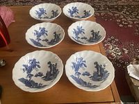 All six Johnson Bros The Old Mill cereal bowls displayed on table