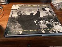 Front cover of Lights, Camera, Action! book showing title, author, and Gregory Peck credit