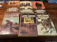 All six Louis L’Amour paperbacks front covers visible