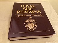 Front view of Loyal She Remains hardcover book