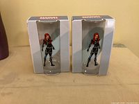 Front view of two boxed Marvel Black Widow glasses