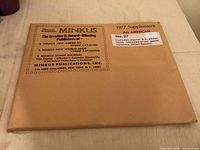 Front of Minkus envelope showing title and publication details
