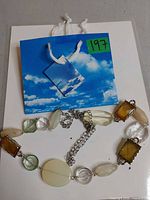 Full view of necklace showing bead arrangement and chain