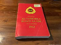 Front view of red softcover Ontario Motor League Official Automobile Road Guide of Canada 1912 reproduction