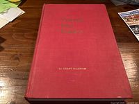 Front cover of red cloth hardcover book with title "Poking Into Politics" and author Grant MacEwan