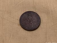 Obverse of 1837 Province Du Bas Canada half-penny token showing standing figure and legend
