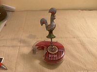 Rooster corkscrew mounted on tape dispenser, front angle
