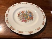 Front view of 8-inch Royal Doulton Bunnykins "Toppling Cart" salad plate