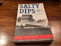 Front cover showing title, subtitle, ship image and publisher