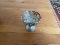 Full view of pierced pedestal bonbon dish on table