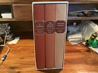 Front view of three Folio Society Thomas Hardy novels in slipcase showing titles and spine colors