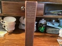 Spine of the book showing title, author, series and publisher