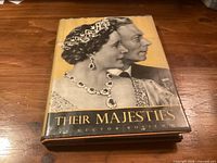 Front dust jacket showing title and photo of King George VI and Queen Elizabeth The Queen Mother