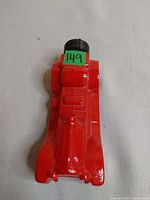 Top view red car-shaped decanter with cap