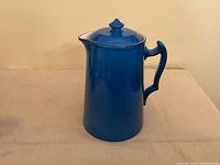 Full view of the blue Cauldon England ceramic coffee pot with lid, showing spout, handle and finial