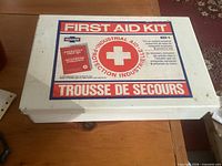 Closed metal first aid kit showing exterior graphics