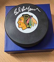Autographed puck on top of display box