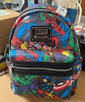 Front view showing Marvel characters pattern and metal plaque