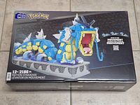 Front of sealed Mega Pokémon Motion Gyarados box showing artwork, piece count and age rating