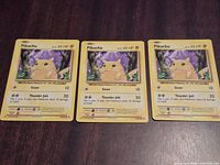 Front view of three Pikachu 35/108 cards showing artwork, HP and moves