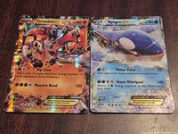 Front view of both Groudon EX #85/160 and Kyogre EX XY14 cards