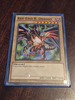 Front of Red-Eyes B. Dragon card in blue sleeve