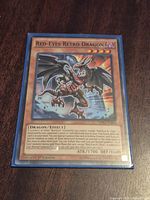 Front of sleeved Red-Eyes Retro Dragon card showing artwork and text