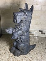 Front view of cast iron Scottish Terrier doorstop showing detailed fur and seated posture