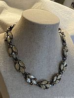 Full view of necklace on bust showing design and length