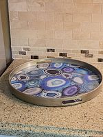 Full view of round geode tray on countertop