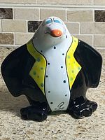 front view of glazed ceramic penguin figurine