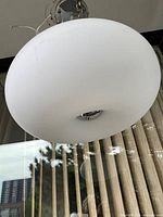 Full view of milk glass pendant light hanging