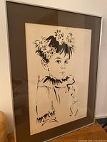 full view of framed lithograph of boy