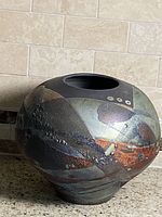 Front view of signed Shu-Chen raku glazed vase
