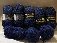 Front view of eight skeins showing labels and colour