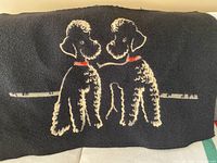 Full view of tapestry showing both poodles and overall design