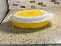 Casserole assembled with lid showing sunflower pattern