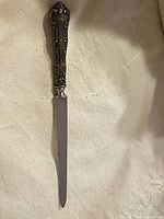 Full view of sterling handle and blade