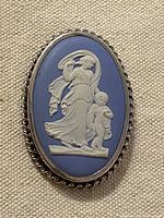 Front view showing cameo scene and silver frame