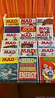 Display rack showing 15 bagged MAD magazines, various covers and Super Specials