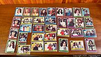 Wide shot of entire group of Charlie's Angels trading cards laid out on table