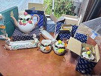 Group shot of all five ceramic pieces with boxes